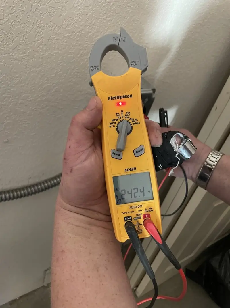 Voltage testing with clamp meter during Electrical Installation Services in Carolina Shores